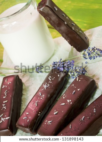 Gourmet lavender chocolate bars on white parchment paper.