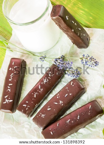 Gourmet lavender chocolate bars on white parchment paper.
