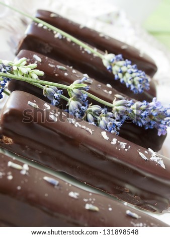 Gourmet lavender chocolate bars on white seving plate.