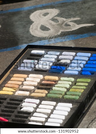 Chalks on the street during Chalk Art Festival in Denver, Colorado.