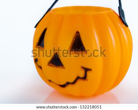 Halloween bag in shape of Jack-o\'-lantern on white background.
