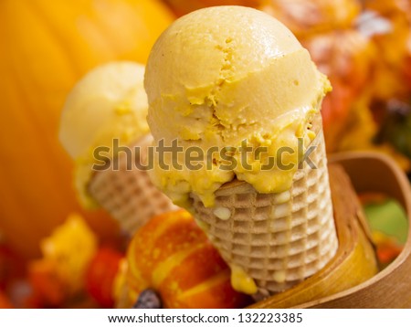 Scoop of gourmet pumpkin gelato in waffle cones.