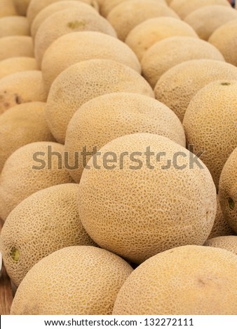 Fresh cantaloupe at the local farmers market. Farmers markets are a traditional way of selling agricultural products.