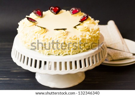 White chocolate cheesecake with brownie crust with white chocolate cream cheese filling, covered in white chocolate ganache.