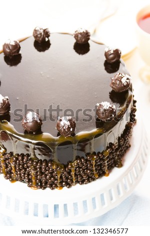 Salted caramel truffle torte with layers of chocolate cake filled with salted caramel mousse, covered in chocolate.