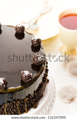 Salted caramel truffle torte with layers of chocolate cake filled with salted caramel mousse, covered in chocolate.