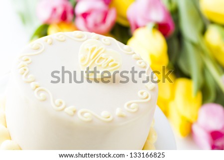 White chocolate honey lavender cake made with sponge cake infused with honey and filled with layers of lavender mousse, covered in white chocolate.