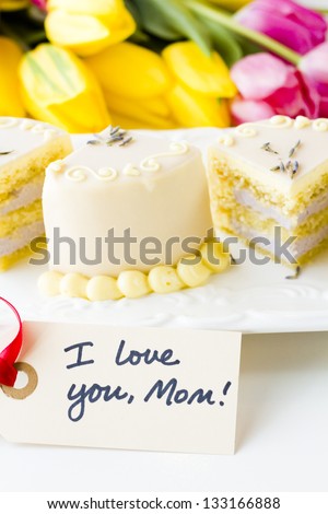 White chocolate honey lavender cake made with sponge cake infused with honey and filled with layers of lavender mousse, covered in white chocolate.