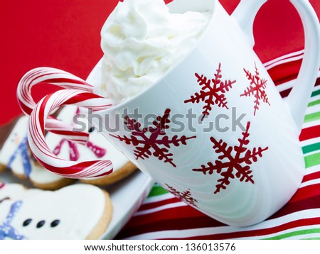 Hot chocolate with peppermint canes and snowman sugar cookies.