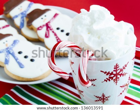 Hot chocolate with peppermint canes and snowman sugar cookies.