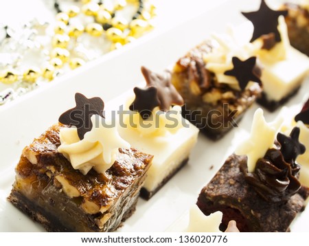 Gourmet assorted petite party pastries decorated for New Year Eve celebration.