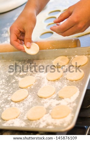 Kids baking cookies in the cooking class.
