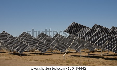 A series of large solar panels forms a symmetrical line at a power plant in the San Luis Valley of central Colorado.
