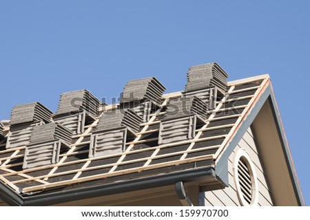 Roof repairs of an apartment building in Colorado.