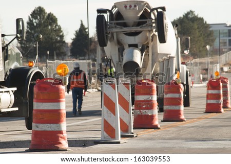 Cement mixer truck at construction site.