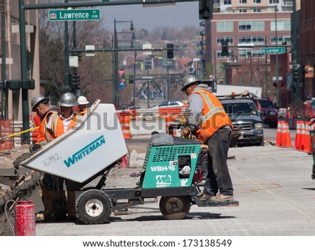 Denver, Colorado-April 9, 2011: Road Construction Worker On New Concrete Road In Downtown Denver, Colorado.