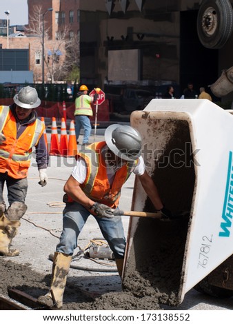 Denver, Colorado-April 9, 2011: Road Construction Worker On New Concrete Road In Downtown Denver, Colorado.