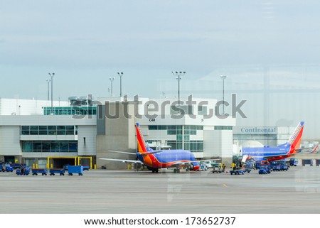 Denver, Colorado-March 29, 2013: Parked airplane at the terminal.