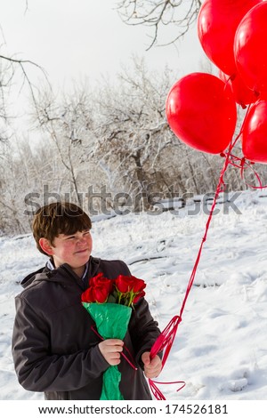 Teenager boy with Valentines Day gifts for his girlfriend.