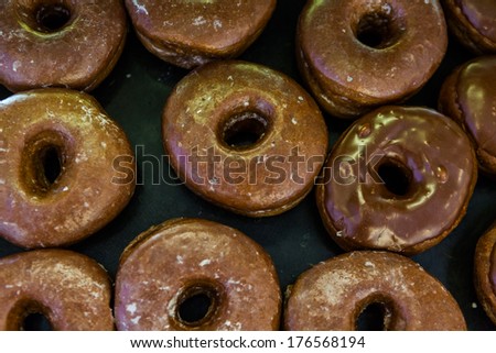 Fresh chocolate donuts from the local bakery shop.
