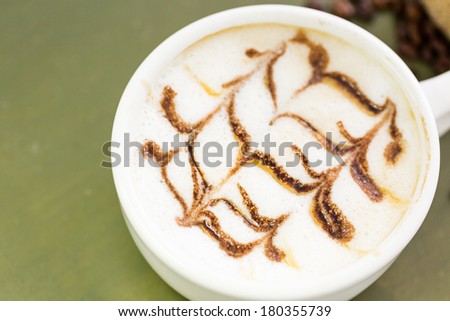 Cappuccino with interesting design on foam.