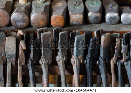 Tools of the blacksmith in blacksmith shop.