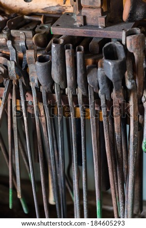 Tools of the blacksmith in blacksmith shop.