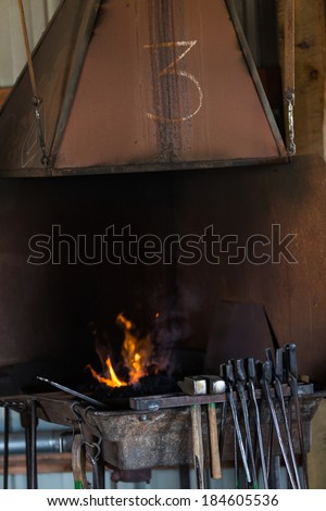 Working forge of the blacksmith in old shop.