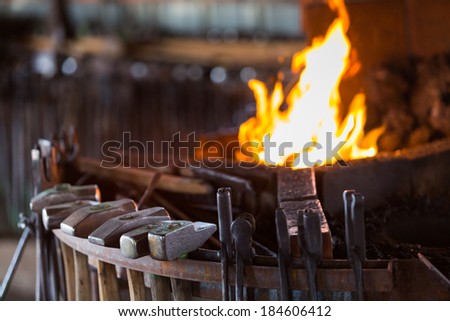 Working forge of the blacksmith in old shop.