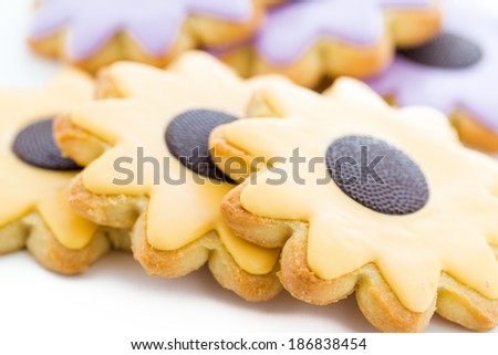 Easter sugar cookies in shape of flower with chocolate icing.