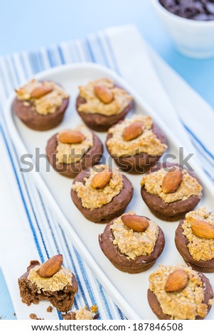 Gluten free chocolate baked snacks with peanut butter and whole almond.