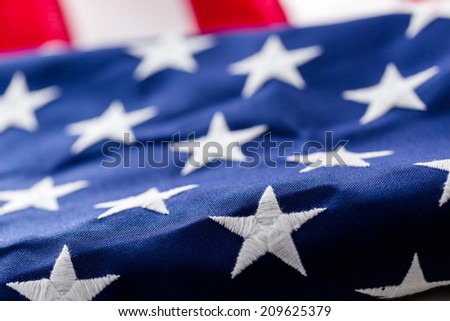 Tight closeup of the stars and stripes of an American Flag.