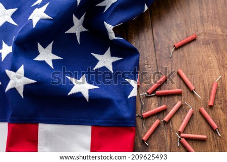 Roll of firecrackers with folded American flag.