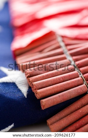 Roll of firecrackers with folded American flag.