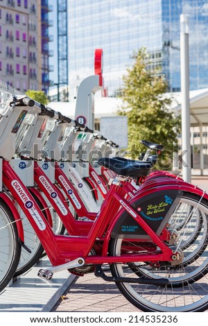 Denver, Colorado, USA-August 31, 2014. Row of red rental bikes in downtown Denver, Colorado.