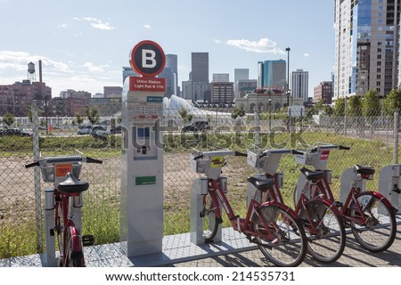 Denver, Colorado, USA-August 31, 2014. Row of red rental bikes in downtown Denver, Colorado.