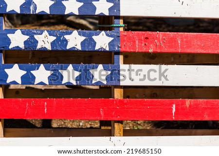American flag painted on top of old wood pallet.