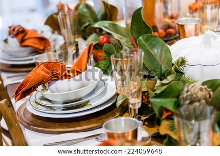 Elegant table prepared for Thanksgiving dinner with family and friends.
