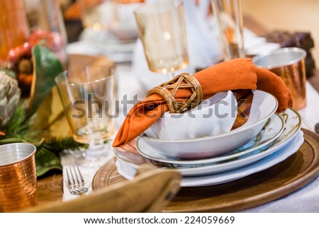 Elegant table prepared for Thanksgiving dinner with family and friends.