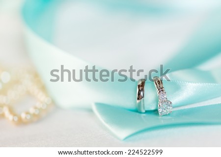 Wedding wings on blue ribbon.