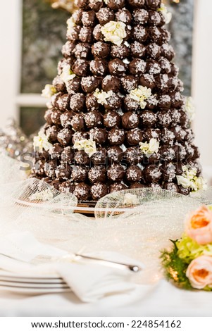 Gourmet truffle cone wedding cake at wedding reception.