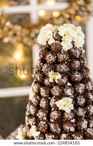 Gourmet truffle cone wedding cake at wedding reception.