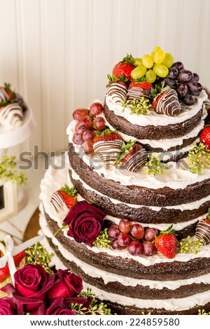 Gourmet tiered wedding cake at wedding reception.