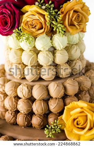 Gourmet tiered wedding cake as centerpiece at the wedding reception.