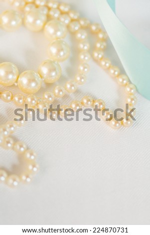 White vintage pearls on the table.