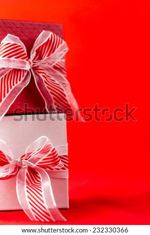 Red and white boxes with Christmas gifts.