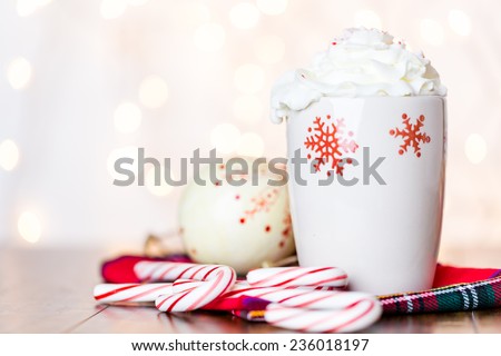 Hot chocolate garnished with whipped cream and crashed peppermint candies.