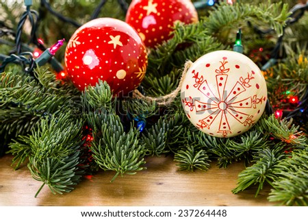 Vintage Christmas ornaments on live egergreen tree.