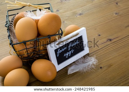 Fresh farm eggs on the wood table.
