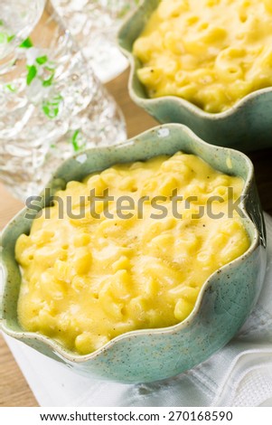 Preparing macaroni and cheese with elbow macaroni.
